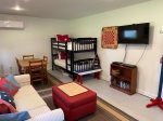 Kid`s paradise with bunk beds and entertainment center